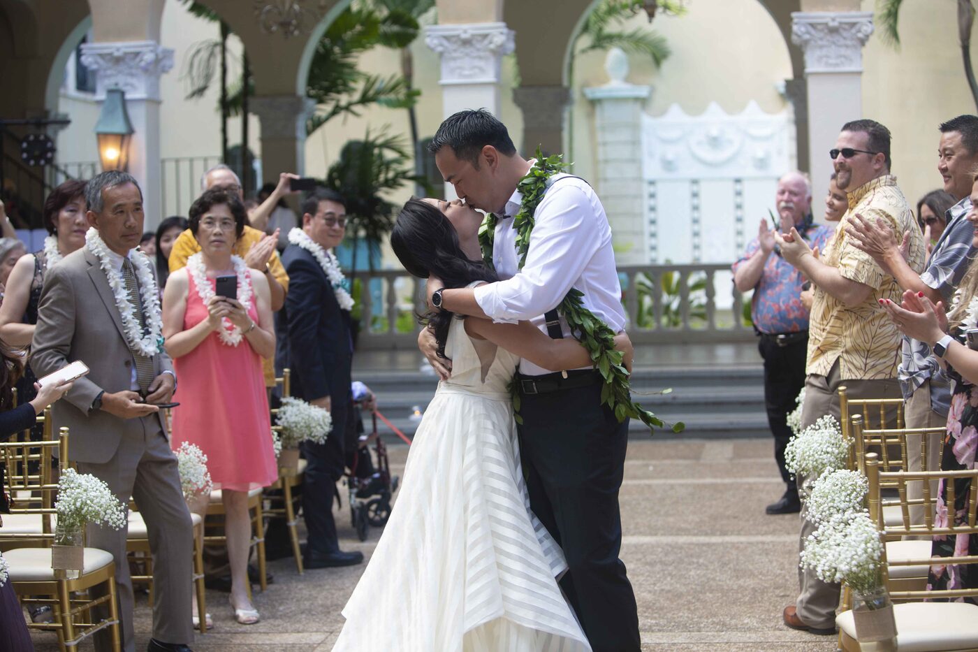 First kiss at a Hawaii wedding ceremony, photographed by Pure Media Hawaii
