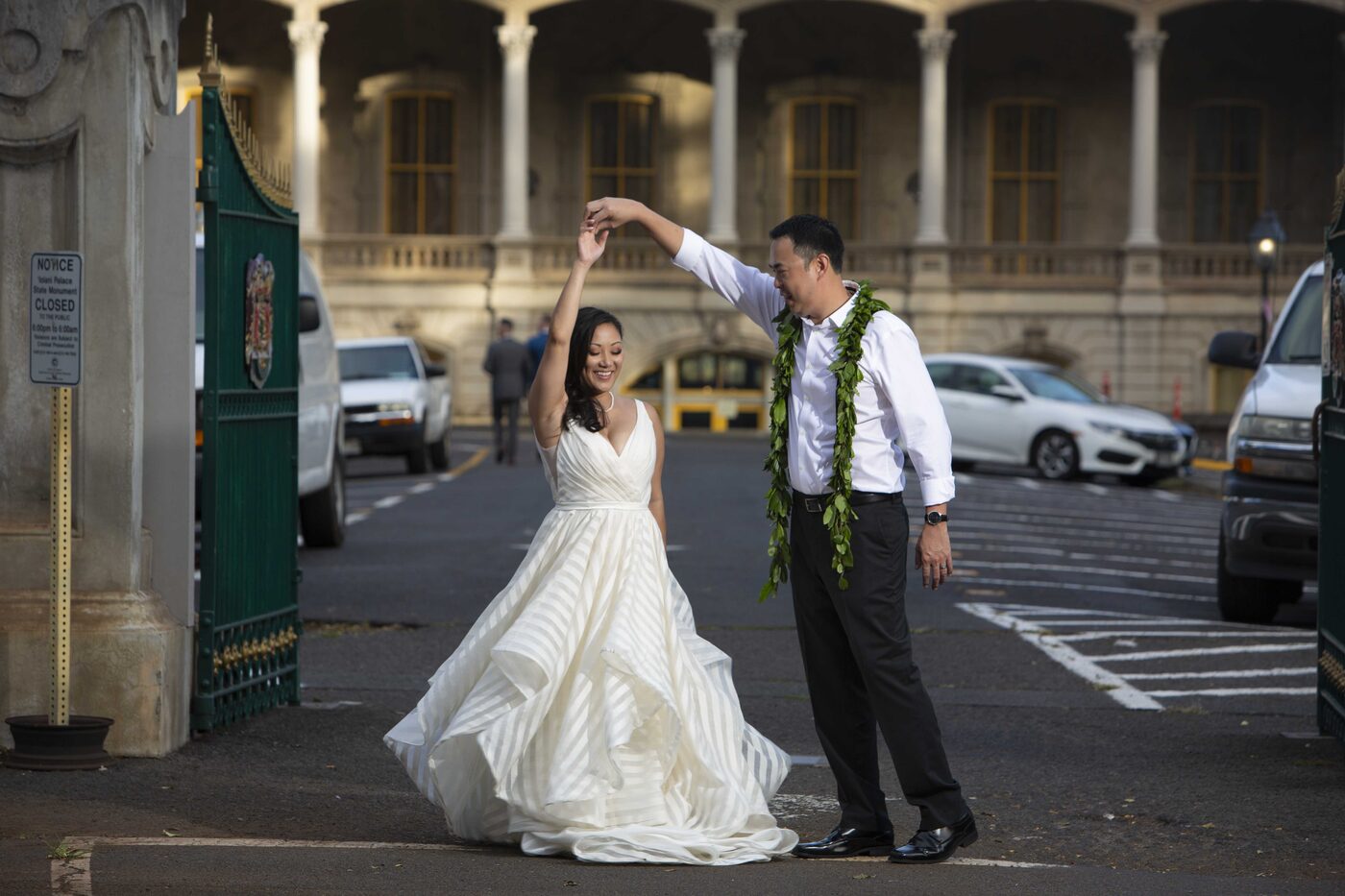 Bride spinning in her dress for a portrait in Honolulu, photographed by Pure Media Hawaii